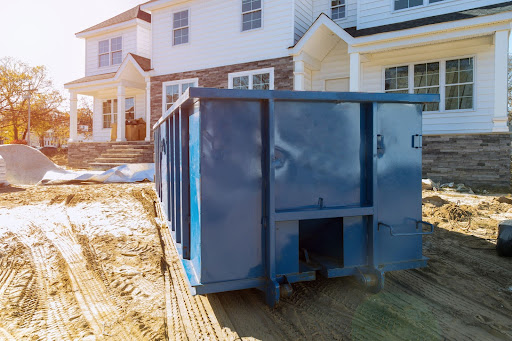 a roll-off dumpster on a residential construction site