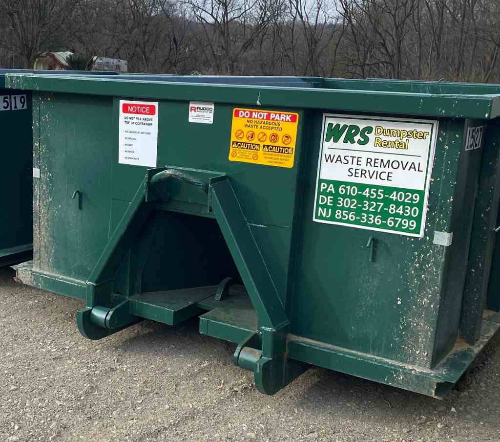 Dumpster placement on a gravel driveway in rural Upper Freehold near Allentown NJ