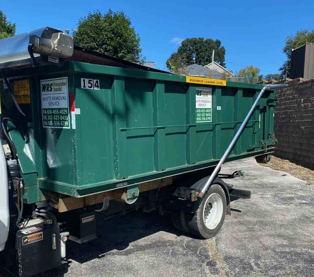 Roll-off dumpster rental in Deptford, NJ WRS roll-off dumpster delivered to a residential driveway in Deptford, NJ