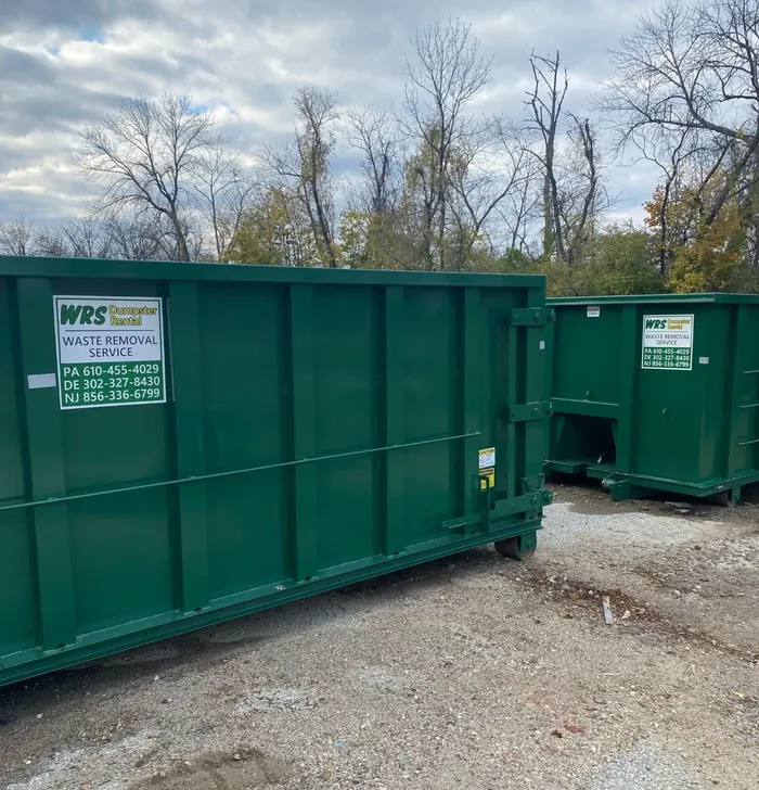 Freshly painted green WRS roll off containers ready for delivery